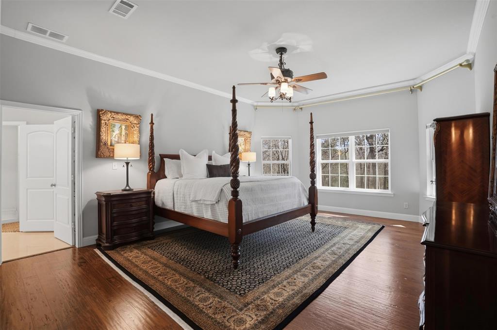 9651 Yellow Rose Lane Pilot Point, TX 76258 - Photo 18 of 38 a bedroom with a bed wooden floor and window