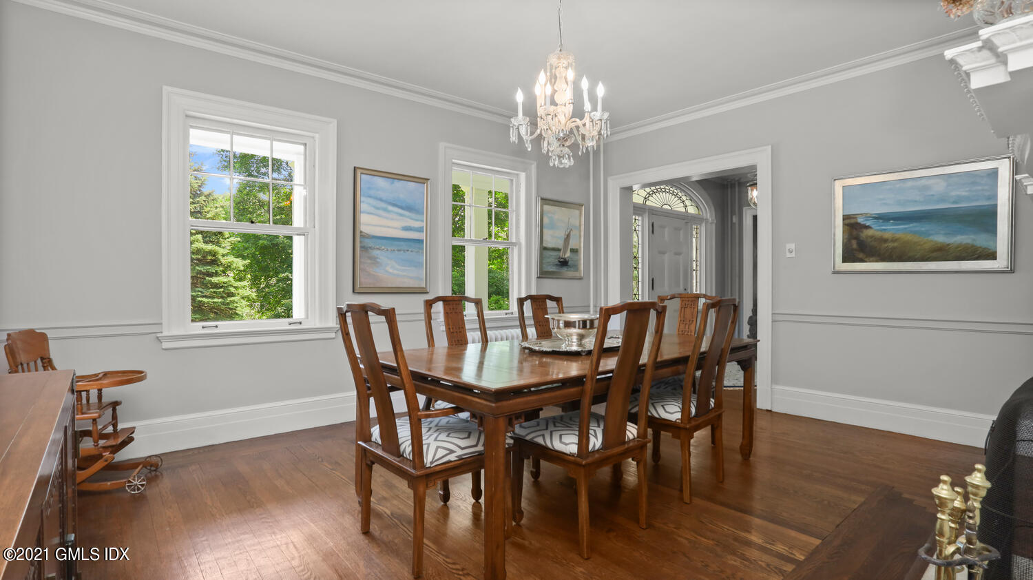 28 Sachem Road Greenwich, CT 06830 - Photo 15 of 36 a view of a dining room with furniture a chandelier and wooden floor