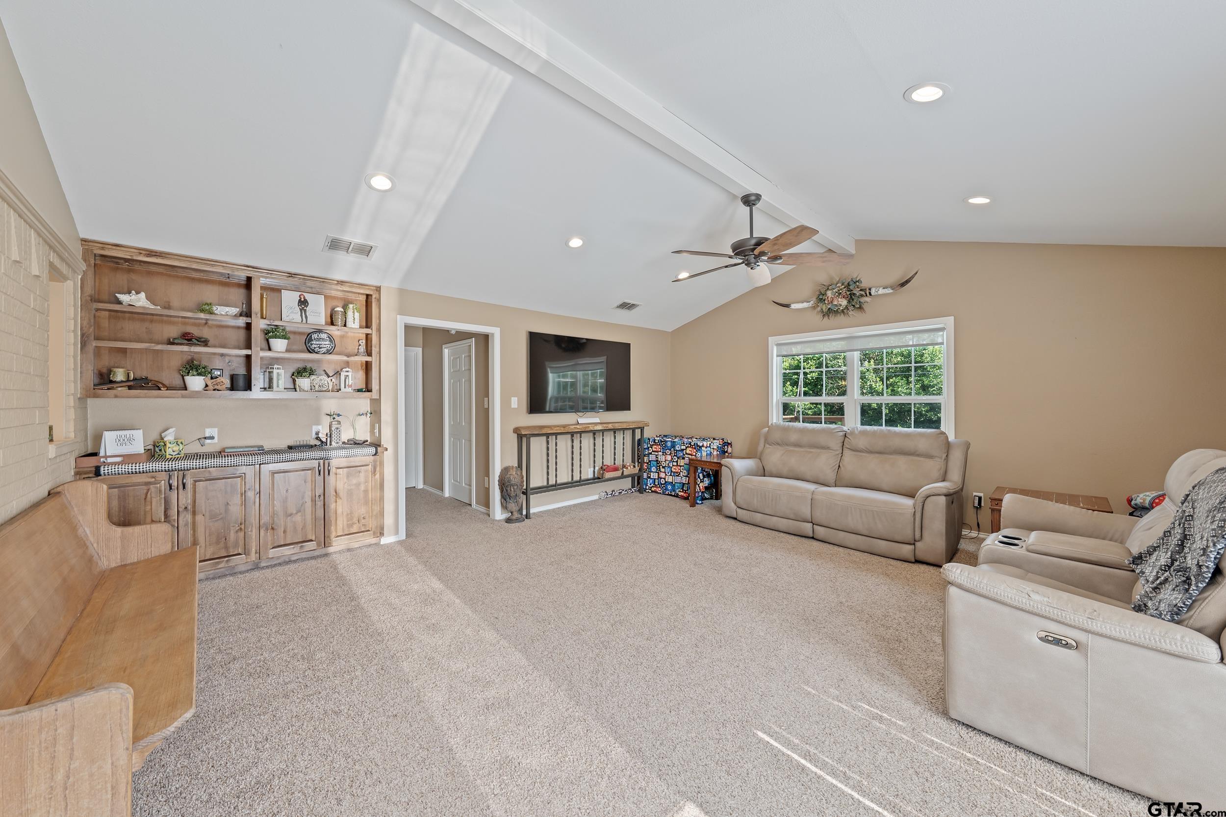200 David Hawkins, TX 75765 - Photo 11 of 36 a living room with furniture and a large window