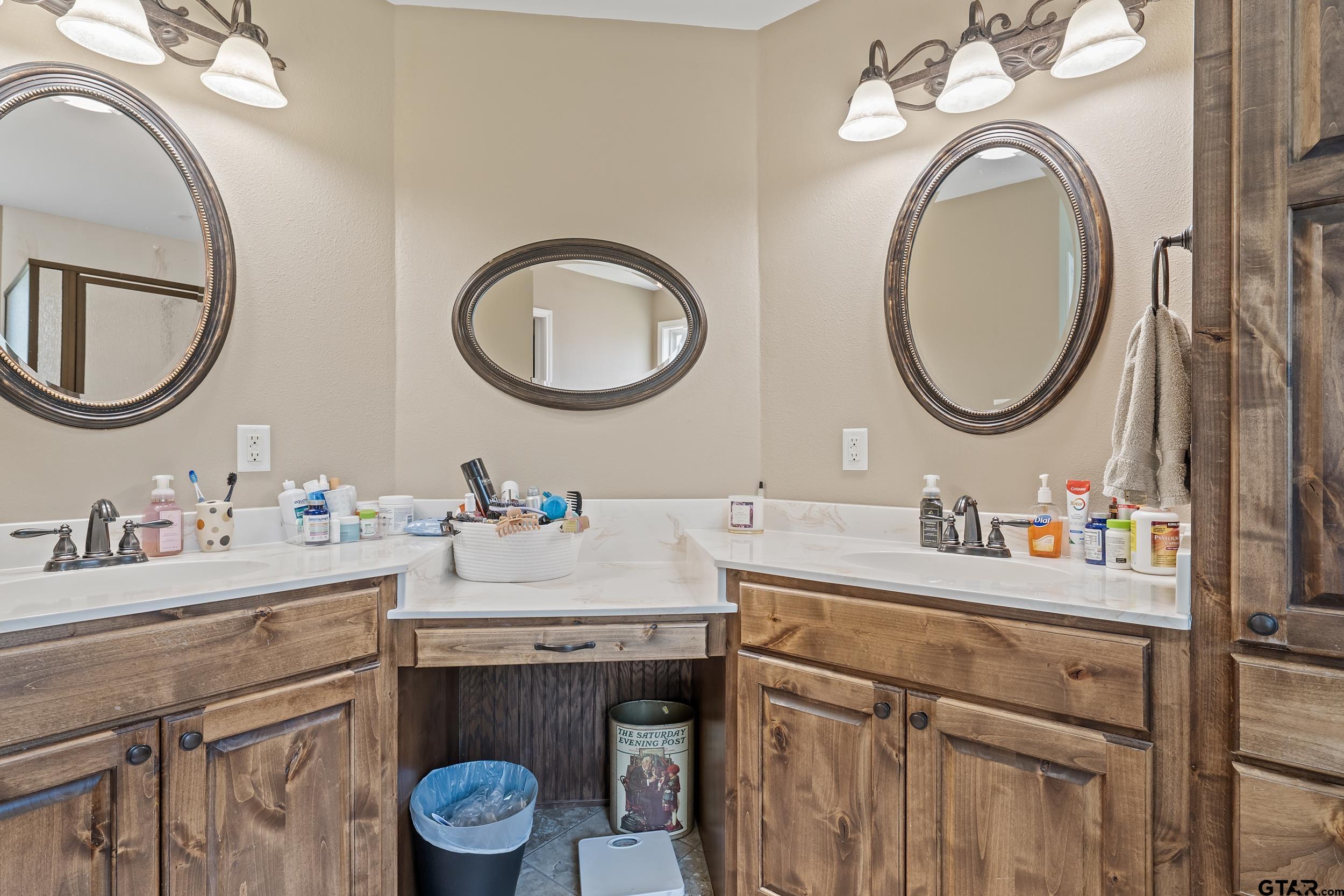 200 David Hawkins, TX 75765 - Photo 16 of 36 a bathroom with a granite countertop double vanity sink and a mirror