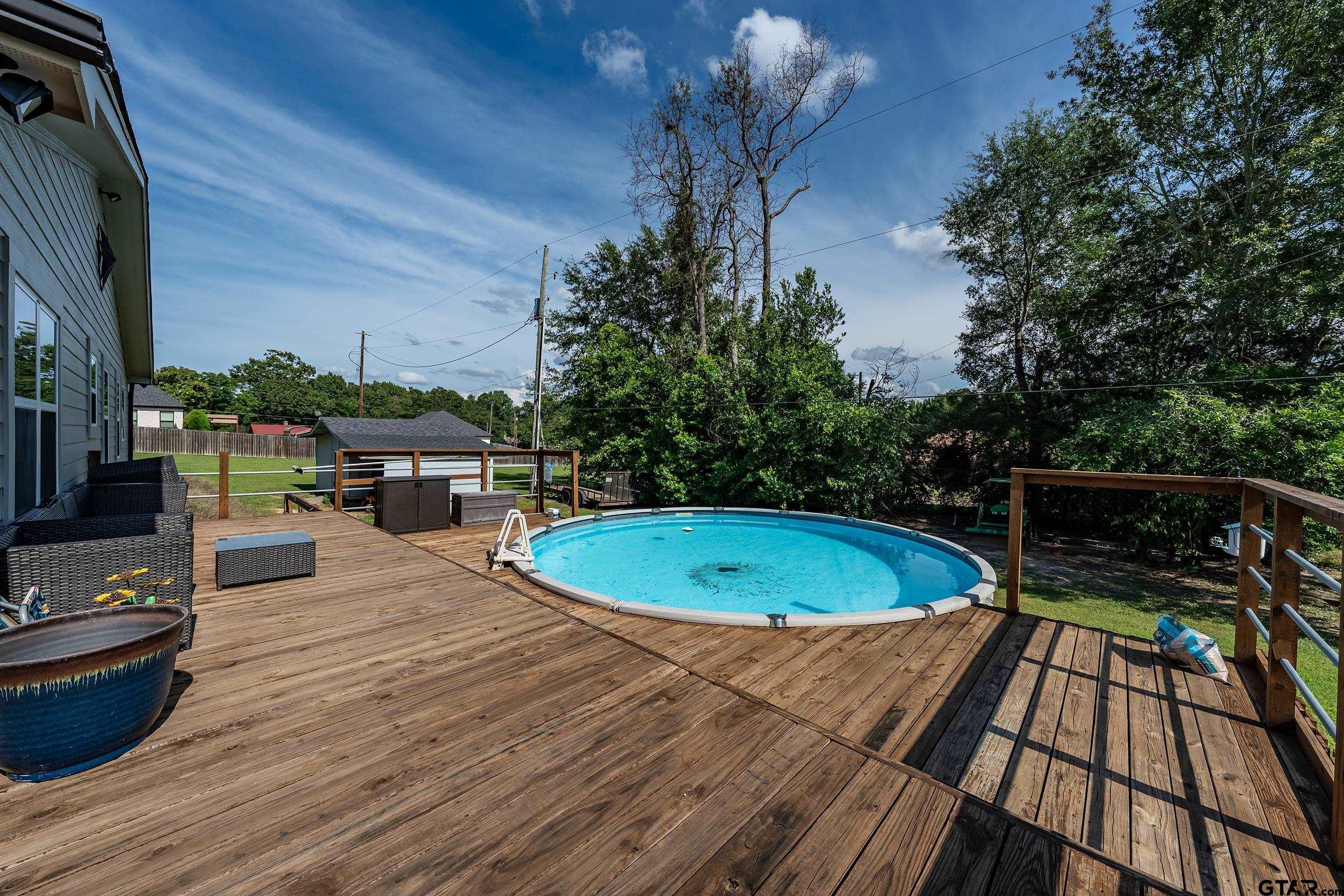200 David Hawkins, TX 75765 - Photo 23 of 36 a view of a swimming pool with a patio
