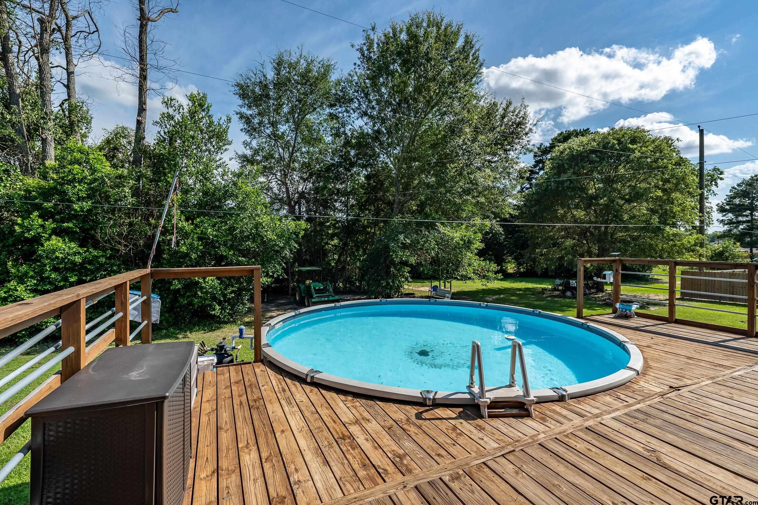 200 David Hawkins, TX 75765 - Photo 24 of 36 a view of a swimming pool with a deck