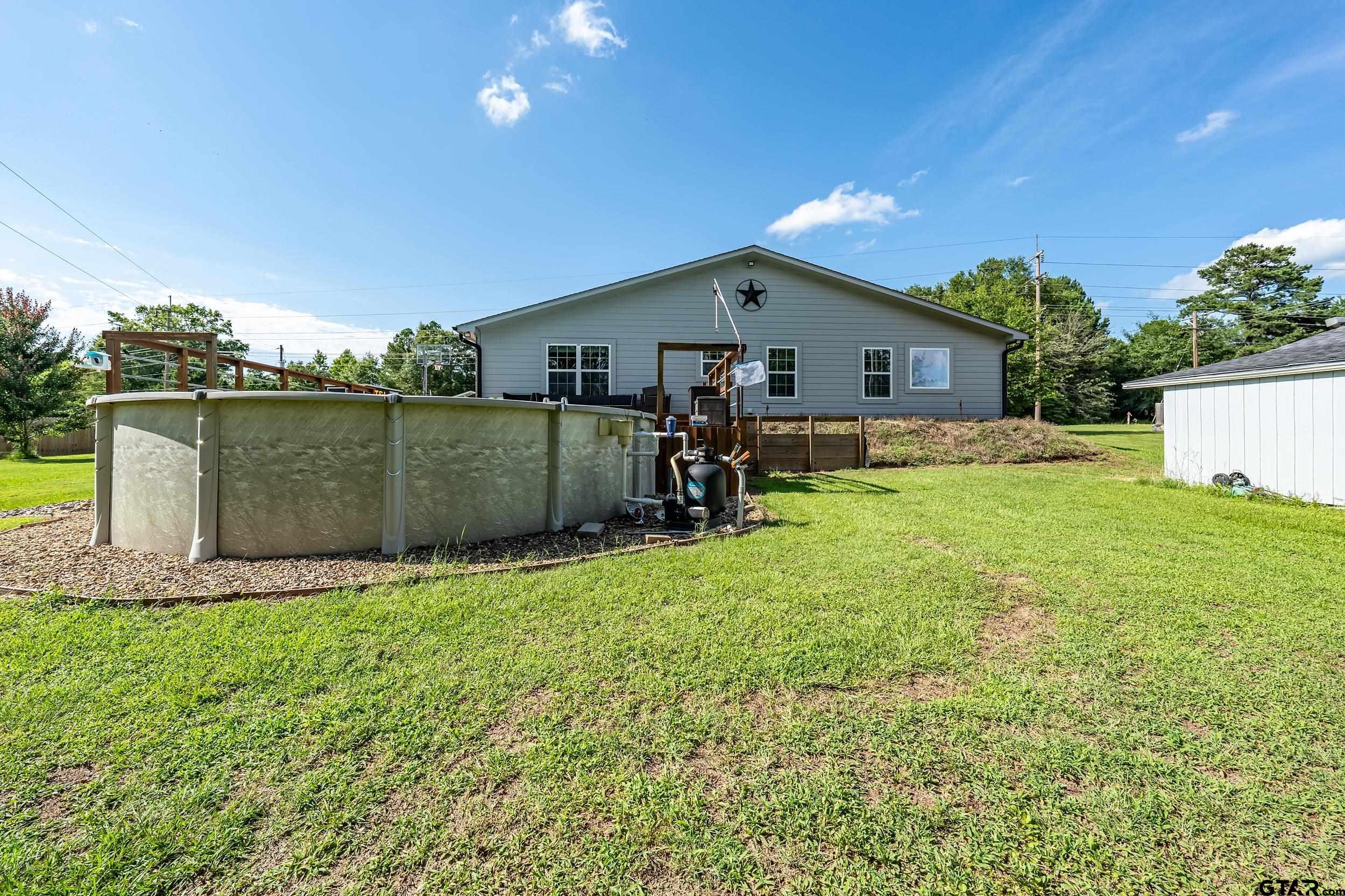 200 David Hawkins, TX 75765 - Photo 26 of 36 a backyard of a house with table and chairs