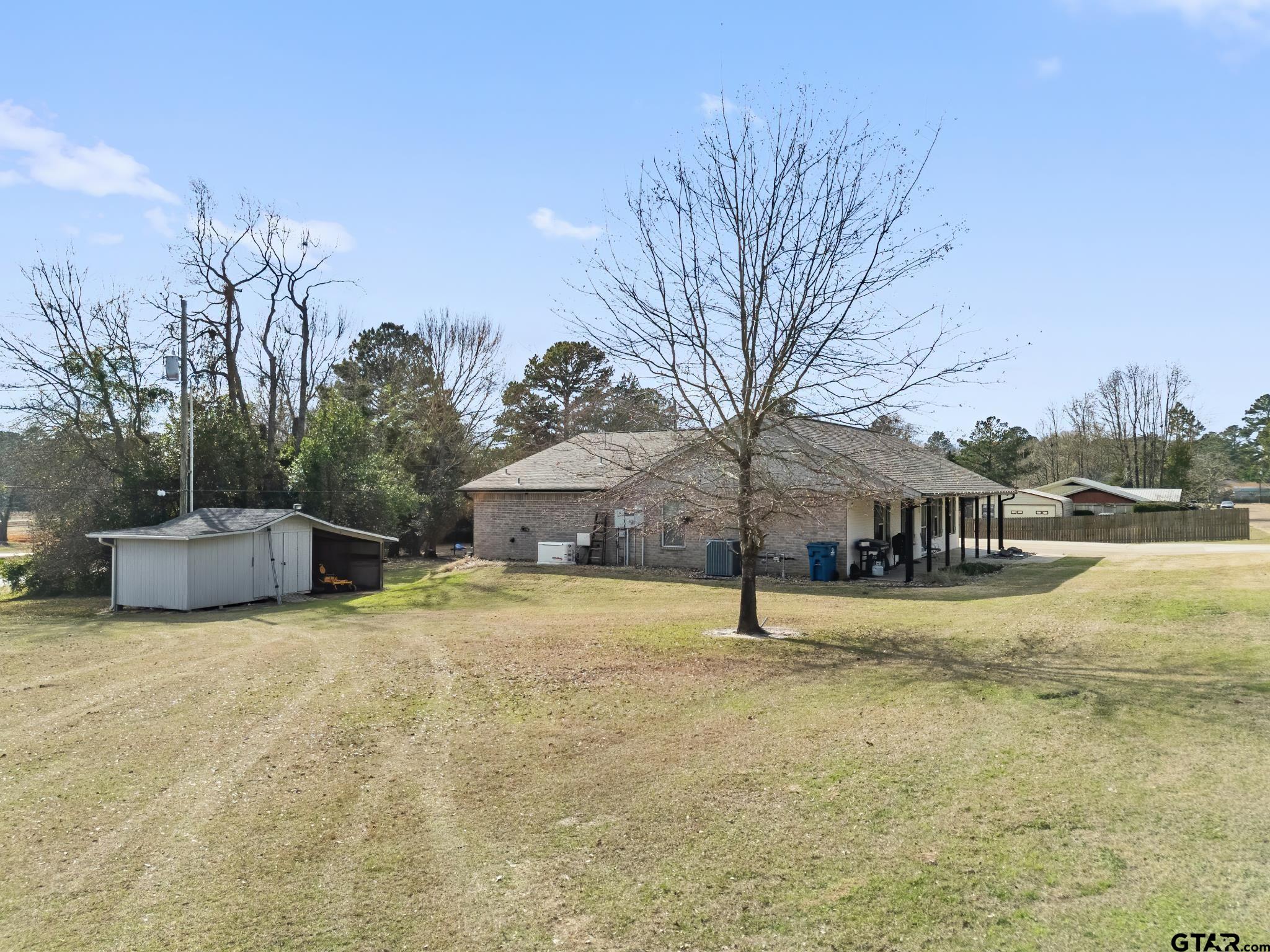 200 David Hawkins, TX 75765 - Photo 33 of 36 a view of a house with a yard and large trees
