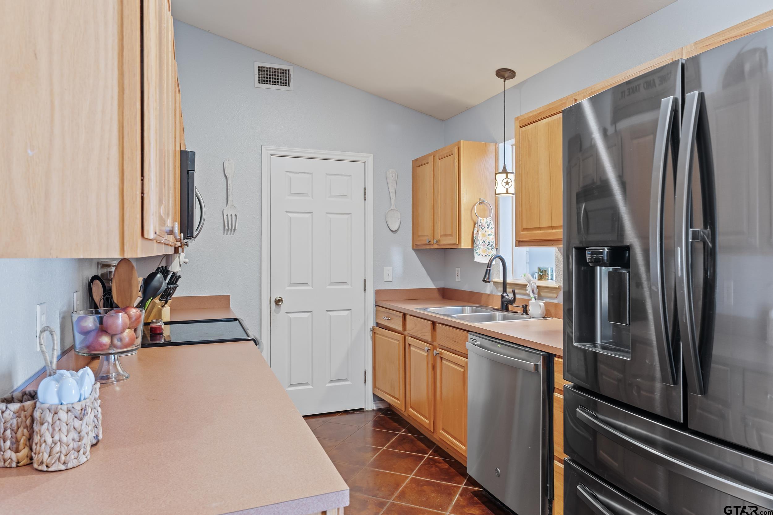 200 David Hawkins, TX 75765 - Photo 6 of 36 a kitchen with stainless steel appliances a refrigerator sink and cabinets