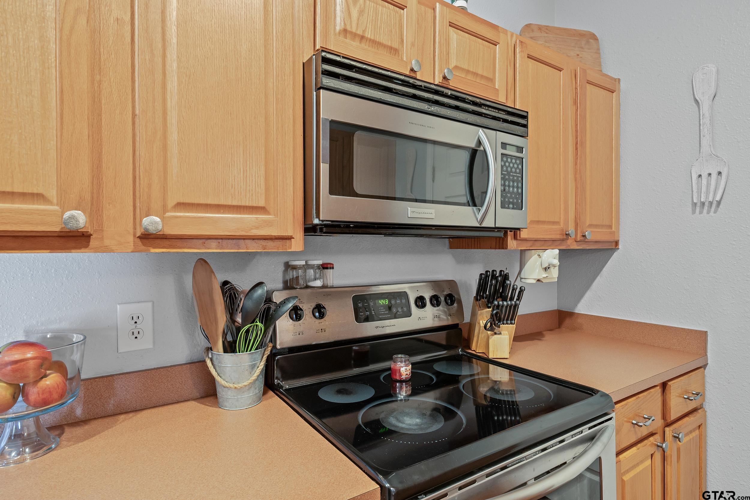200 David Hawkins, TX 75765 - Photo 7 of 36 a kitchen with stainless steel appliances a stove a microwave a sink and cabinets