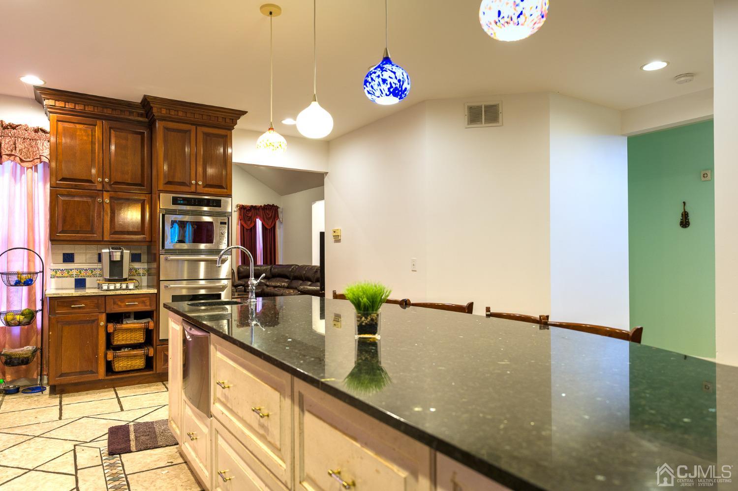 110 Ravine Road Green Brook, NJ 08812 - Photo 12 of 38 a kitchen with granite countertop a sink and a stove