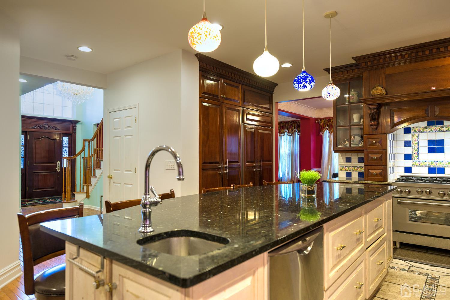 110 Ravine Road Green Brook, NJ 08812 - Photo 13 of 38 a kitchen with a sink a counter top space and living room view