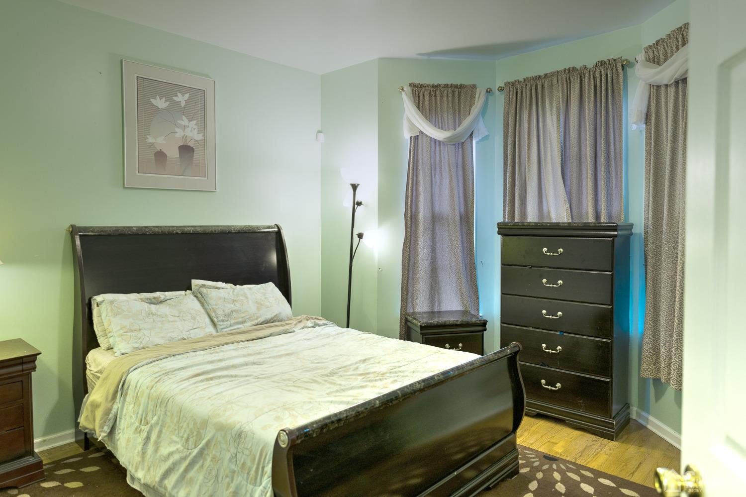 110 Ravine Road Green Brook, NJ 08812 - Photo 15 of 38 a bedroom with a bed and a dresser