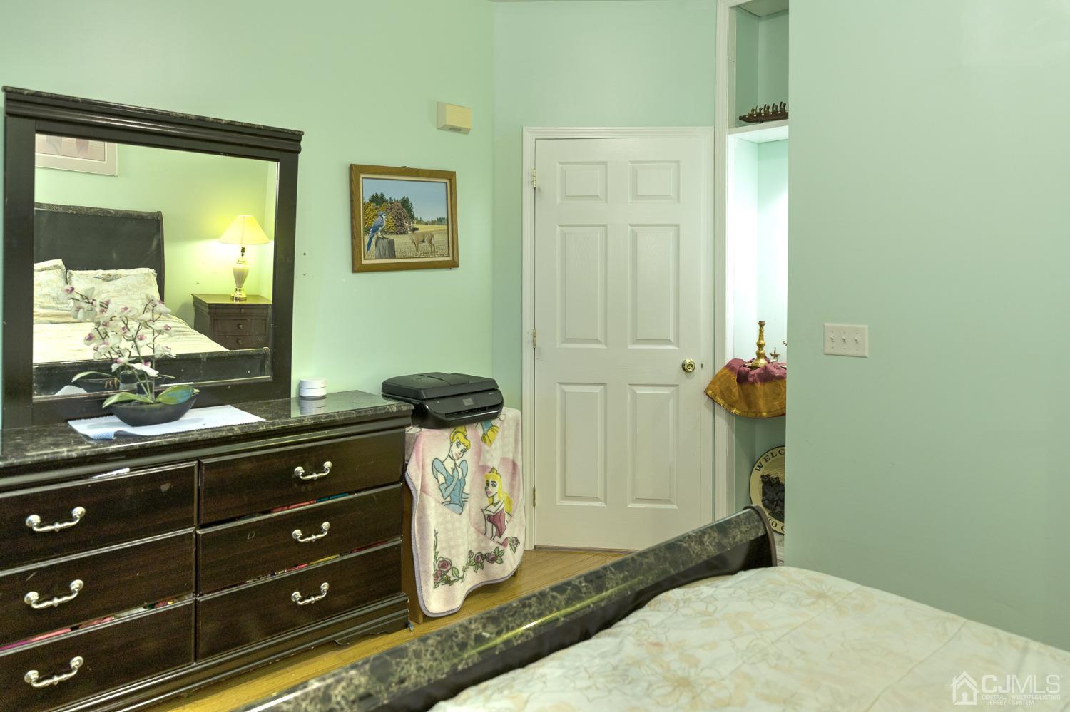 110 Ravine Road Green Brook, NJ 08812 - Photo 17 of 38 a room with a mirror and furniture