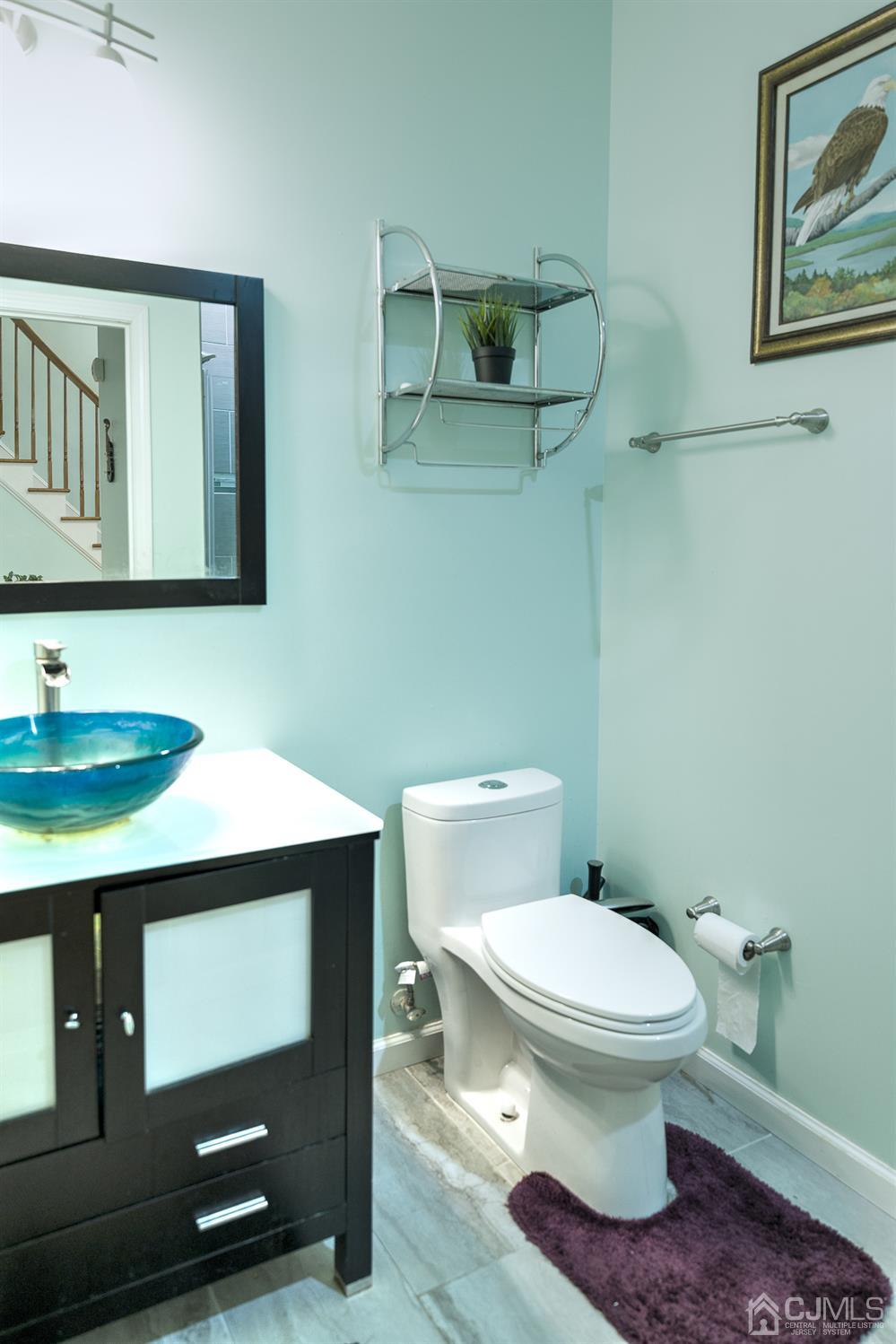 110 Ravine Road Green Brook, NJ 08812 - Photo 18 of 38 a bathroom with a toilet a sink and mirror