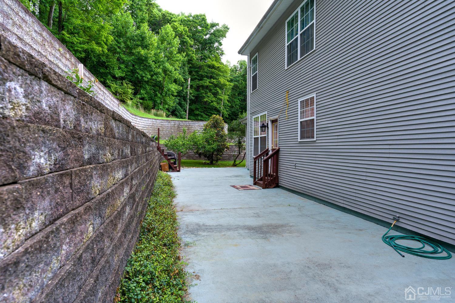 110 Ravine Road Green Brook, NJ 08812 - Photo 37 of 38 a view of a backyard with pathway