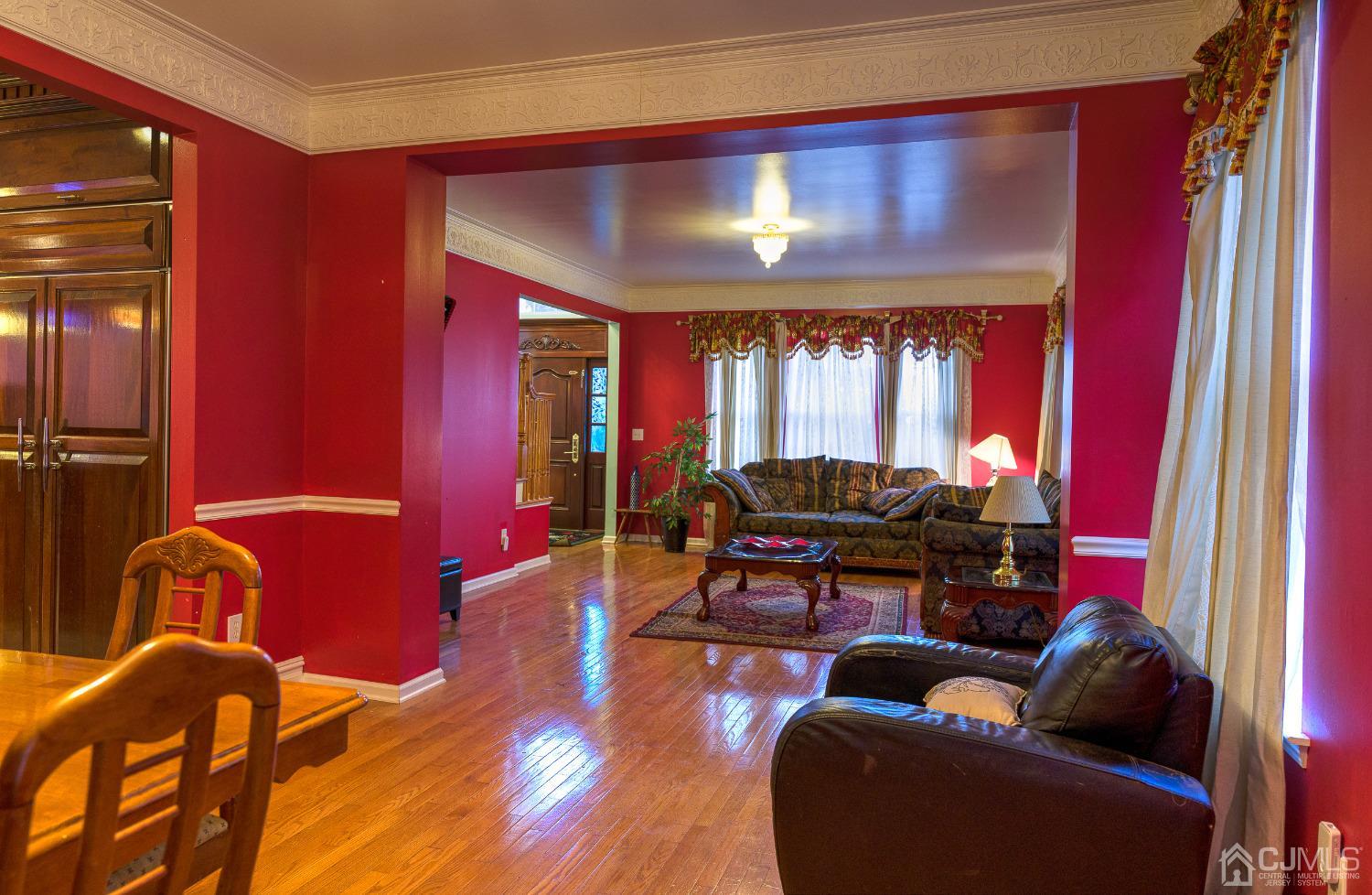 110 Ravine Road Green Brook, NJ 08812 - Photo 5 of 38 a living room with furniture and a potted plant
