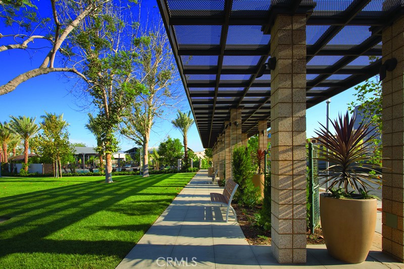 21 Gramercy, Unit 102 Irvine, CA 92612 - Photo 21 of 30 Lush palm lined community grounds creating a true Southern California resort atmosphere.