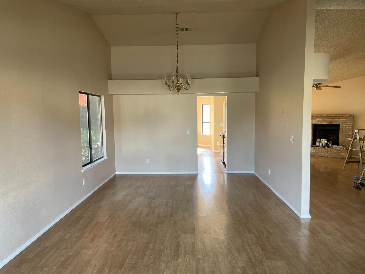 2586 Barstow Avenue Clovis, CA 93611 - Photo 3 of 10 wooden floor in an empty room with a window