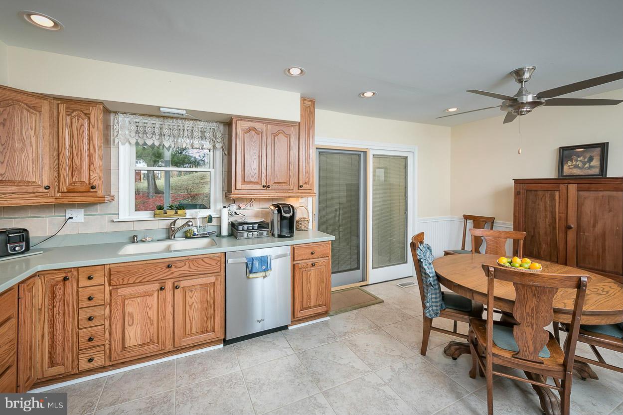 9408 Oak White Road Baltimore, MD 21236 - Photo 11 of 30 a large kitchen with a table and chairs in it