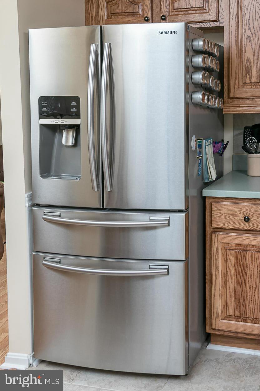 9408 Oak White Road Baltimore, MD 21236 - Photo 16 of 30 a close view of a refrigerator in kitchen