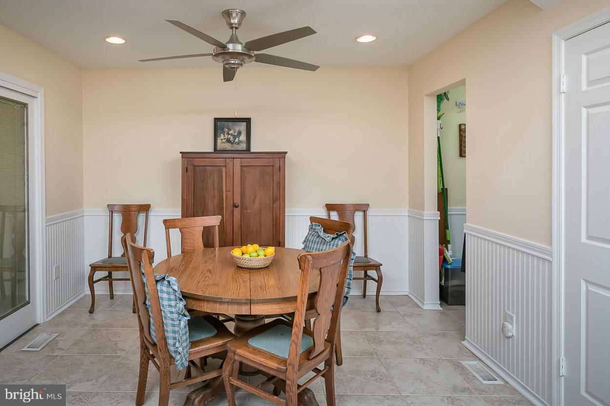 9408 Oak White Road Baltimore, MD 21236 - Photo 17 of 30 a view of a dining room with furniture