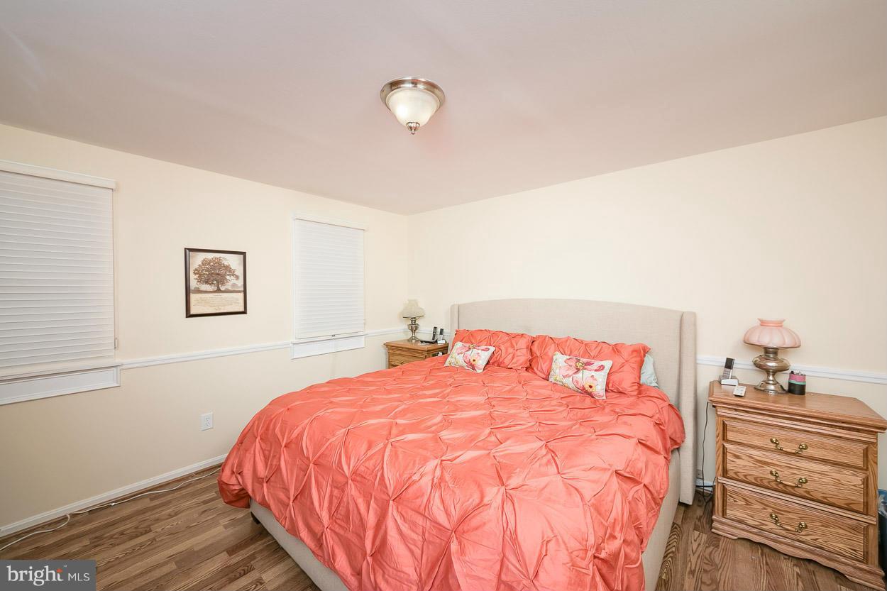 9408 Oak White Road Baltimore, MD 21236 - Photo 18 of 30 a bedroom with a bed and a window