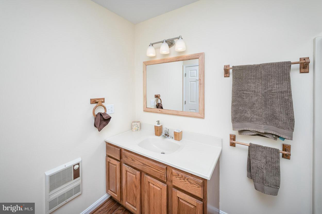 9408 Oak White Road Baltimore, MD 21236 - Photo 23 of 30 a bathroom with a sink and a mirror