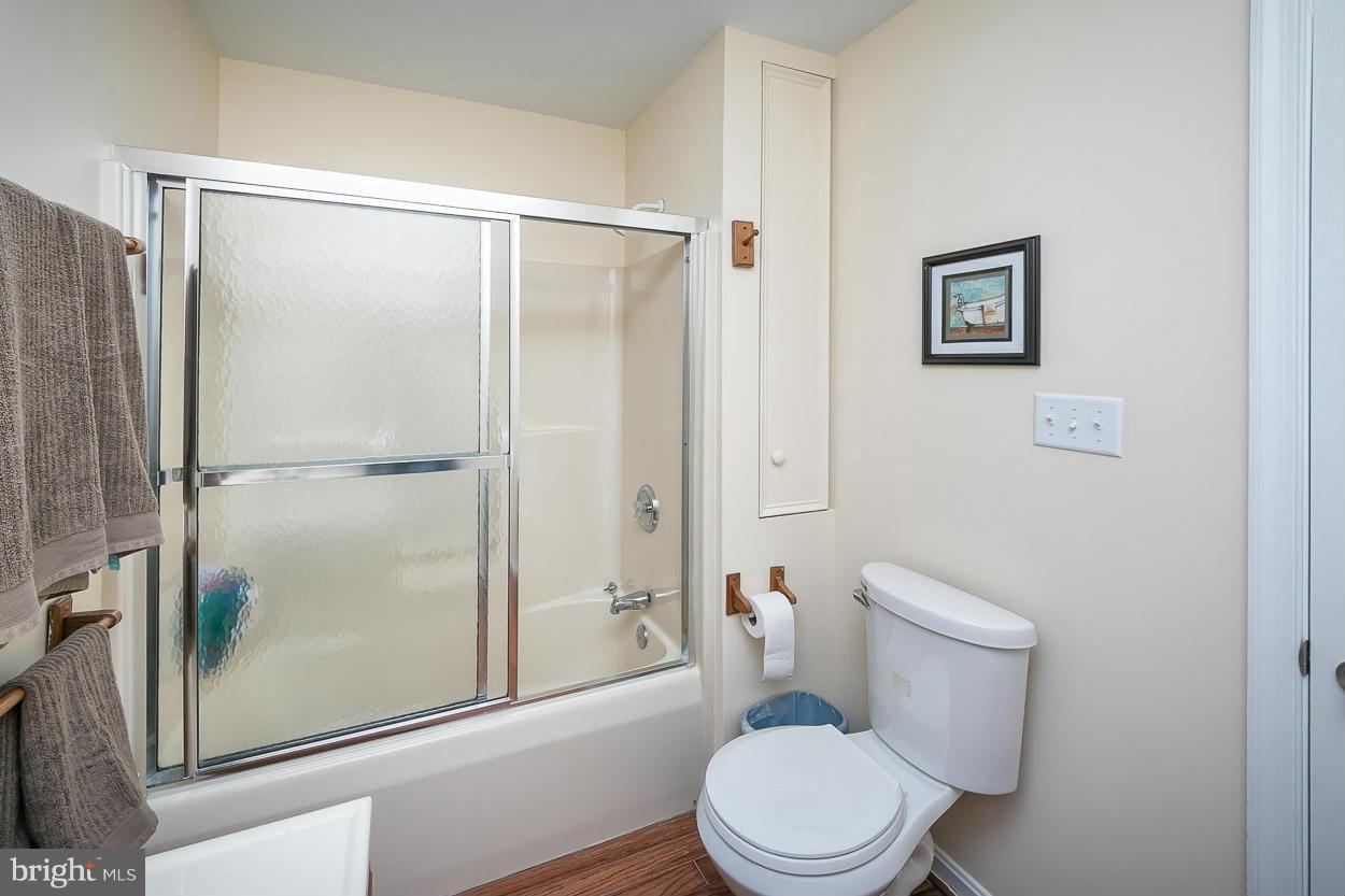 9408 Oak White Road Baltimore, MD 21236 - Photo 24 of 30 a white toilet sitting next to a bathroom sink