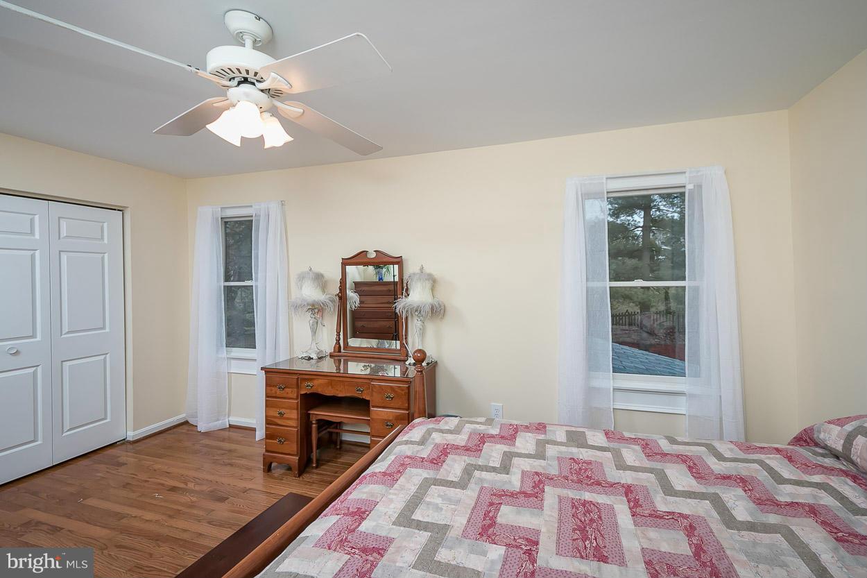 9408 Oak White Road Baltimore, MD 21236 - Photo 25 of 30 a bedroom with a bed and a fireplace