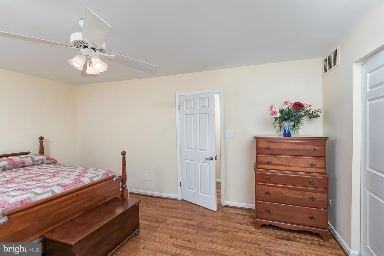 9408 Oak White Road Baltimore, MD 21236 - Photo 26 of 30 a bedroom with a bed and a dresser