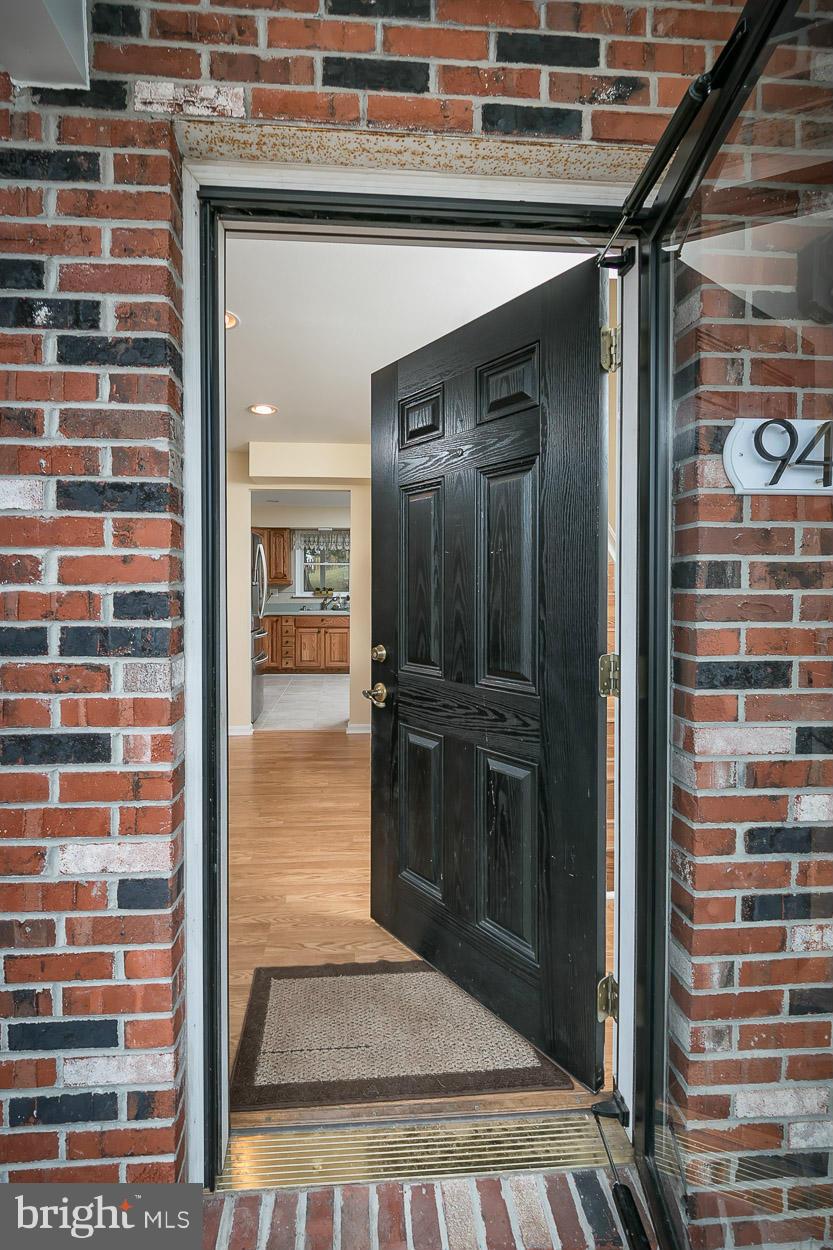 9408 Oak White Road Baltimore, MD 21236 - Photo 5 of 30 a view of a hallway with wooden floor