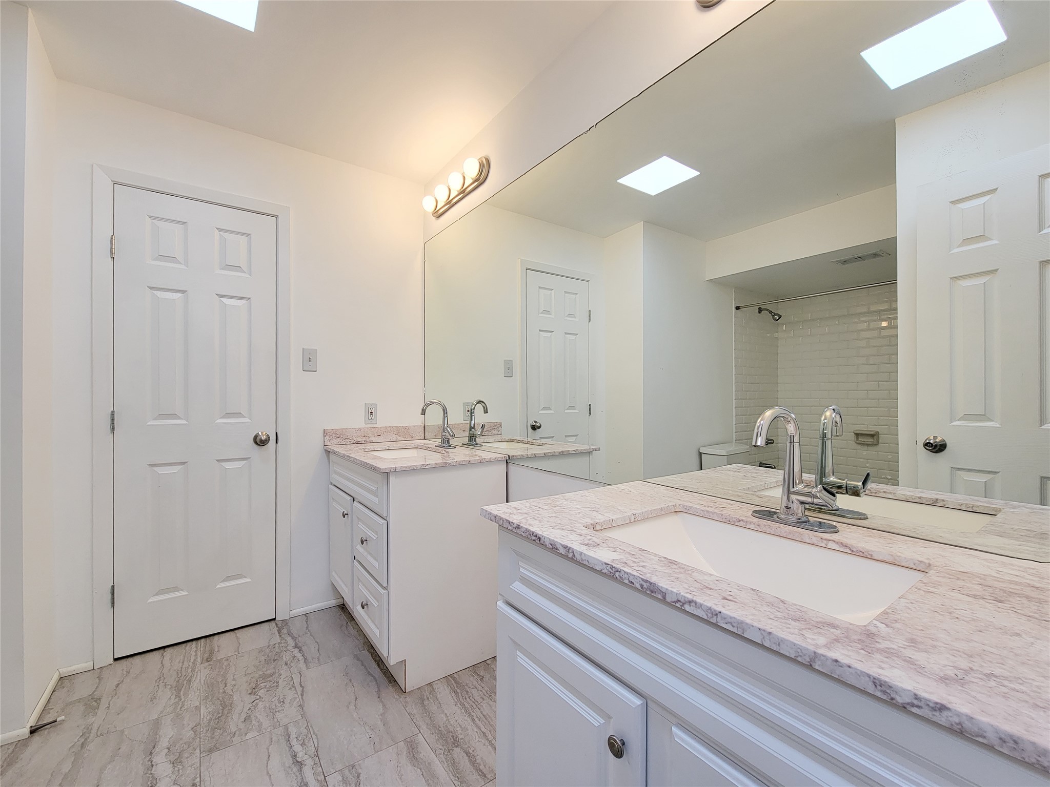 2243 West Alabama Street, Unit B Houston, TX 77098 - Photo 25 of 44 a bathroom with a sink and a mirror