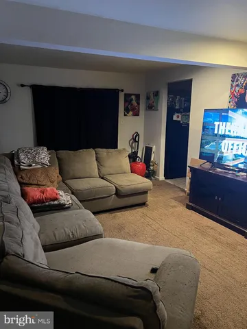 a living room with furniture and window