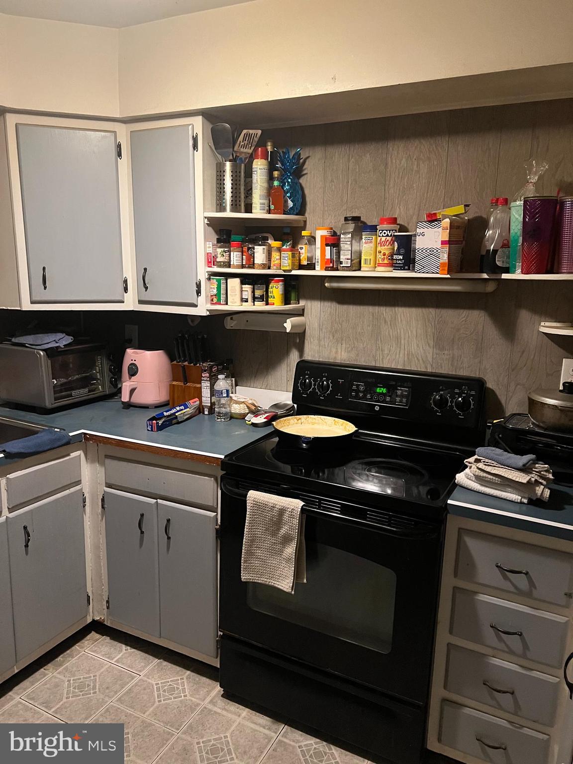 105 Berkshire Road Sicklerville, NJ 08081 - Photo 3 of 4 a kitchen with stainless steel appliances granite countertop a stove and a microwave