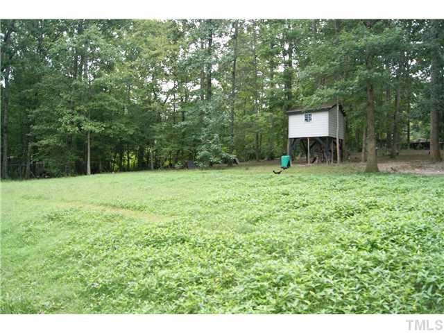 501 Academy Street Raleigh, NC 27603 - Photo 10 of 12 a backyard of a house with lots of green space