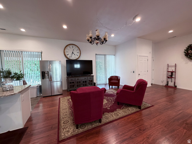 2855 South 1000 West Perry, UT 84302 - Photo 115 of 142 Living area with dark wood-type flooring and hanging lights