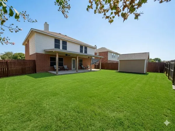 a front view of house with yard and outdoor seating