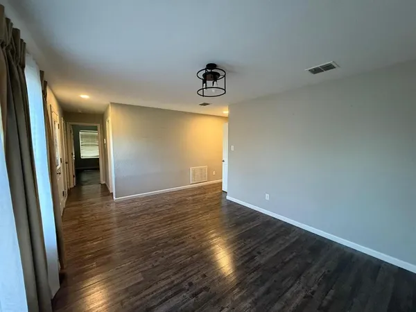 a view of an empty room and window