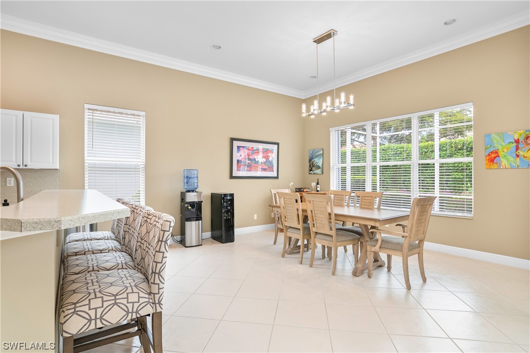 20524 Foxworth Circle Estero, FL 33928 - Photo 12 of 34 a dining room with furniture and window
