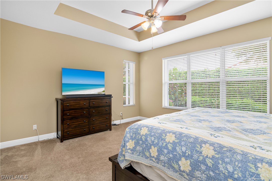 20524 Foxworth Circle Estero, FL 33928 - Photo 20 of 34 a bedroom with a bed and a dresser
