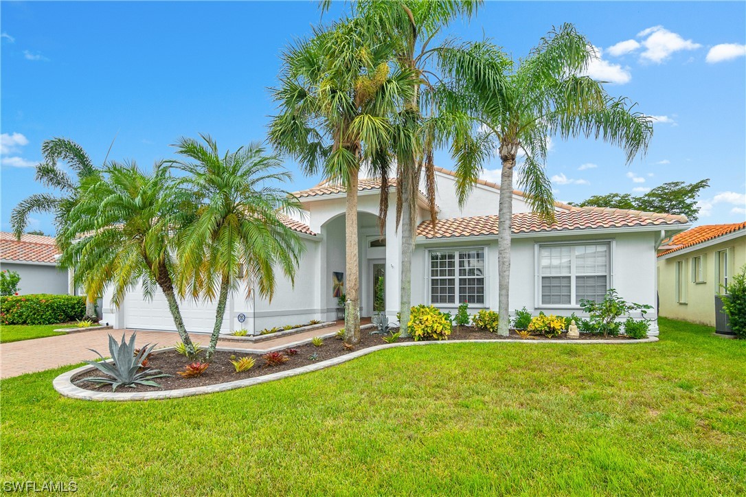 20524 Foxworth Circle Estero, FL 33928 - Photo 3 of 34 a front view of house with yard and green space