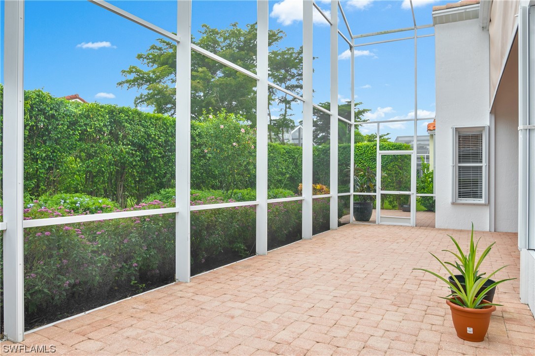 20524 Foxworth Circle Estero, FL 33928 - Photo 31 of 34 a view of a house with a large window and a yard