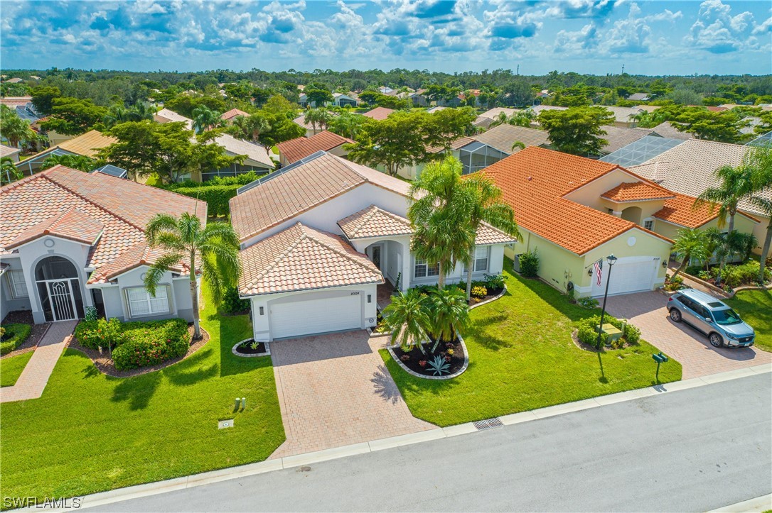 20524 Foxworth Circle Estero, FL 33928 - Photo 33 of 34 an aerial view of a house with a garden and swimming pool