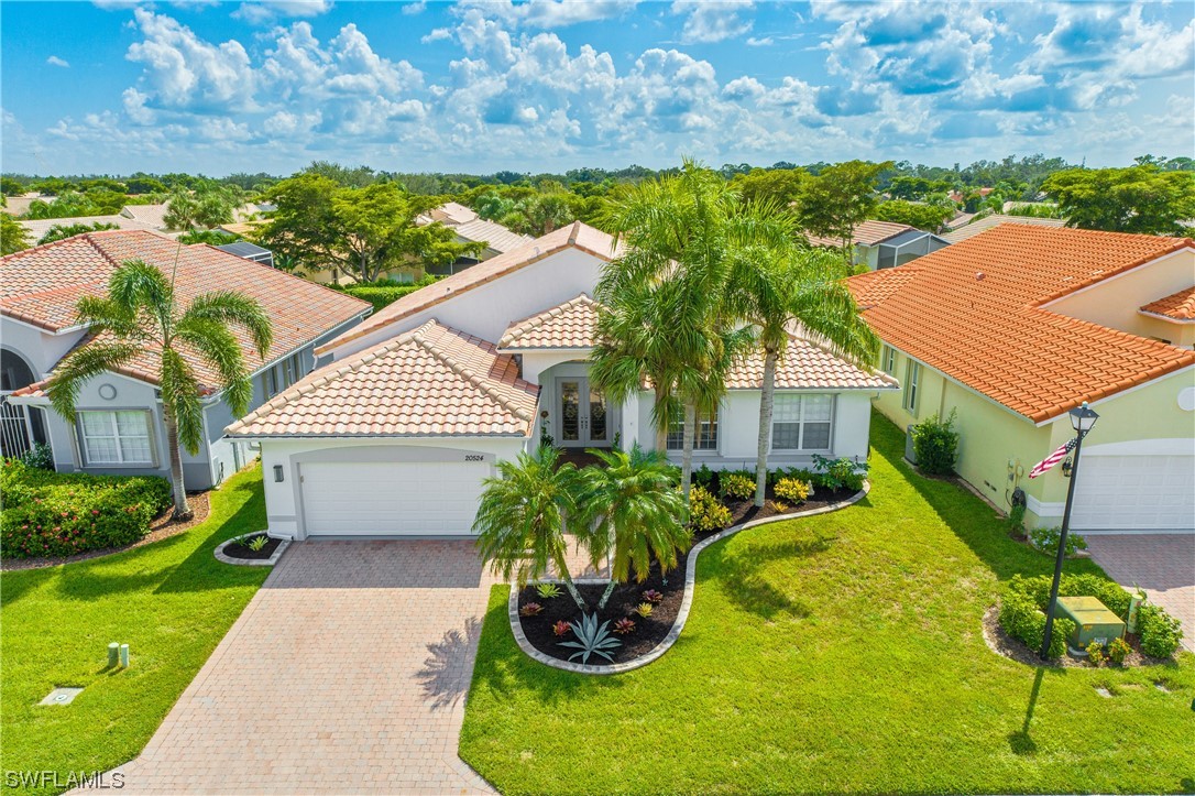 20524 Foxworth Circle Estero, FL 33928 - Photo 34 of 34 a front view of a house with a yard