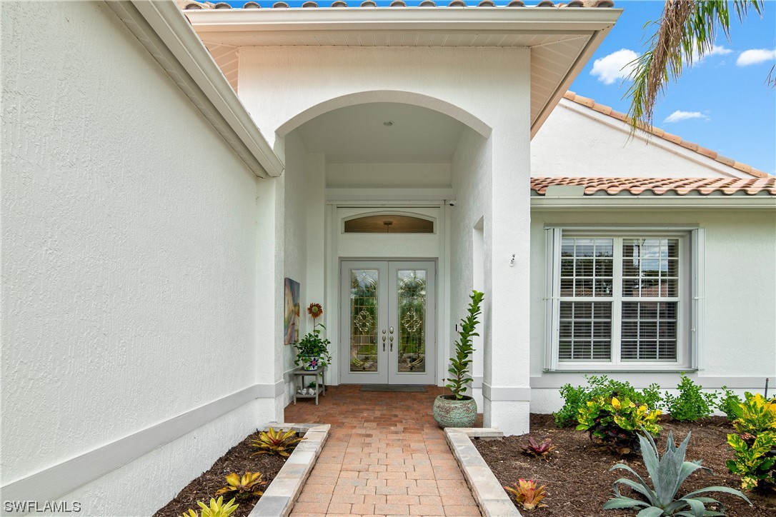 20524 Foxworth Circle Estero, FL 33928 - Photo 4 of 34 a front view of a house with a porch