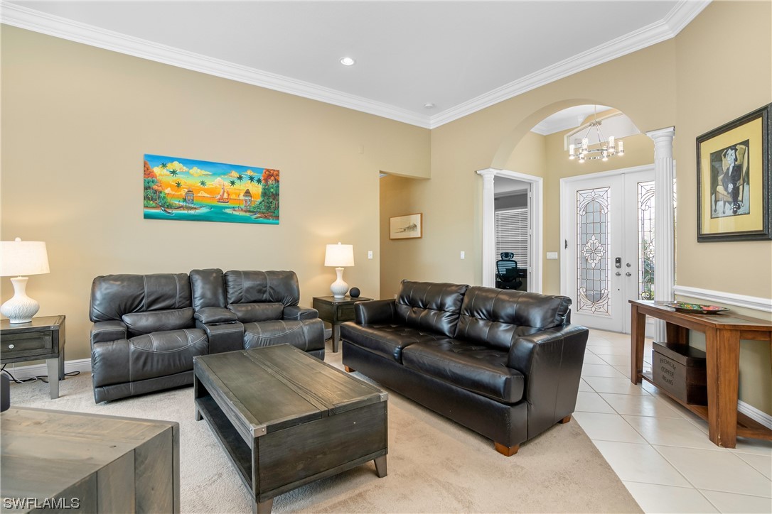 20524 Foxworth Circle Estero, FL 33928 - Photo 6 of 34 a living room with furniture and a fireplace