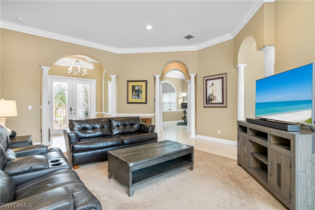 20524 Foxworth Circle Estero, FL 33928 - Photo 7 of 34 a living room with furniture and a fireplace