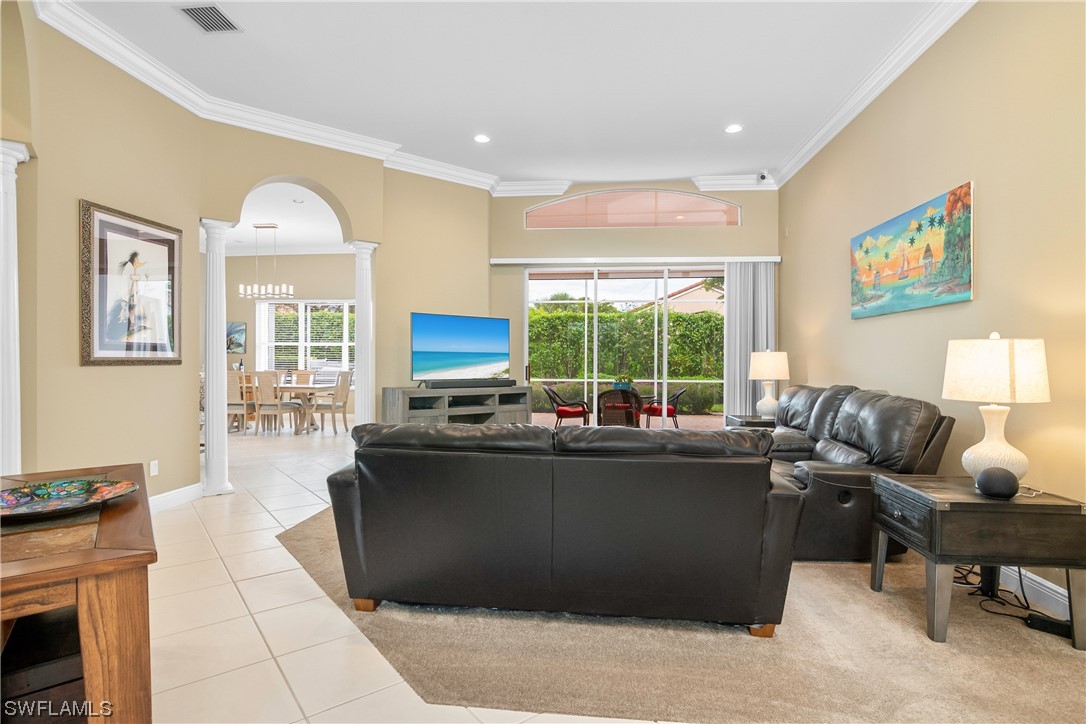20524 Foxworth Circle Estero, FL 33928 - Photo 8 of 34 a living room with furniture and a large window