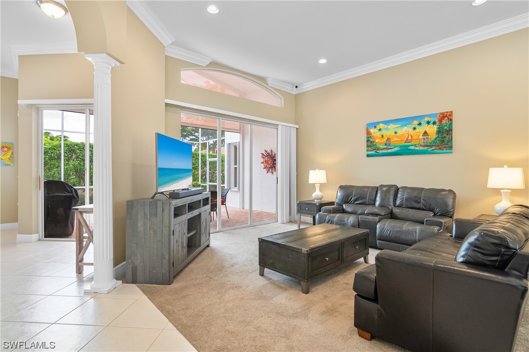 20524 Foxworth Circle Estero, FL 33928 - Photo 9 of 34 a living room with furniture and a flat screen tv