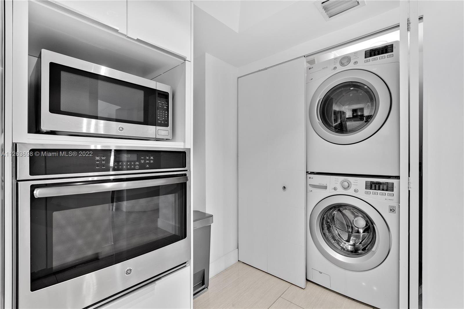 520 Brickell Key Drive, Unit A1819 Miami, FL 33131 - Photo 13 of 35 a close up view of washer and dryer
