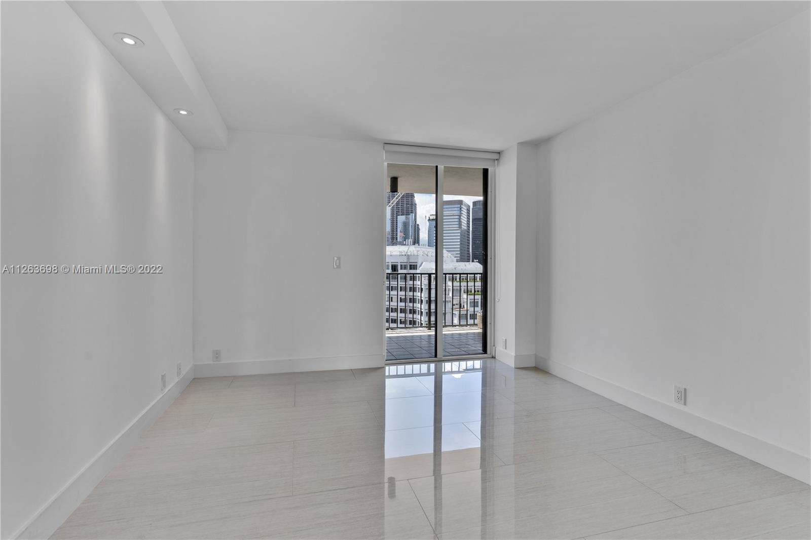 520 Brickell Key Drive, Unit A1819 Miami, FL 33131 - Photo 21 of 35 wooden floor in an empty room