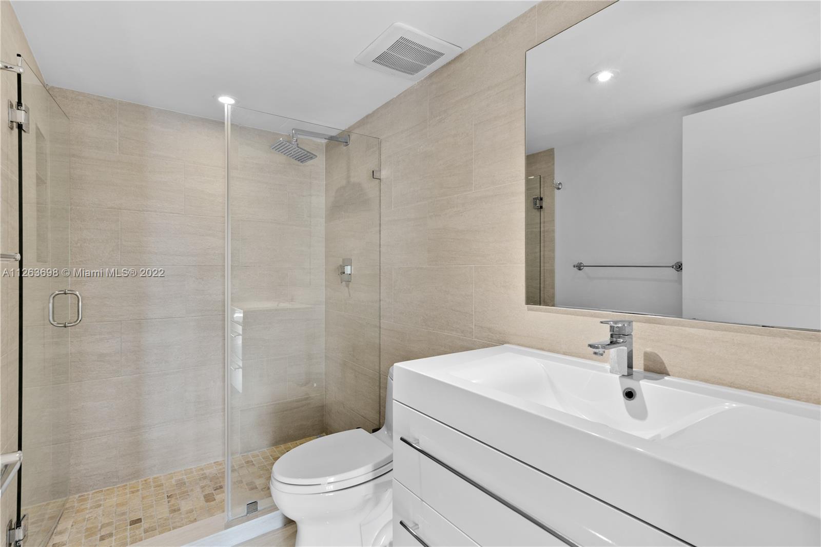 520 Brickell Key Drive, Unit A1819 Miami, FL 33131 - Photo 23 of 35 a bathroom with a sink toilet and shower