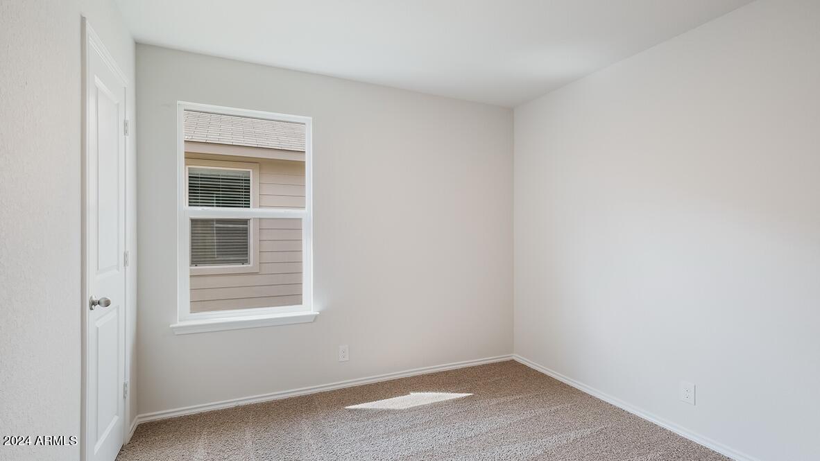 2067 West Solstice Avenue Apache Junction, AZ 85120 - Photo 10 of 12 Amber bedroom